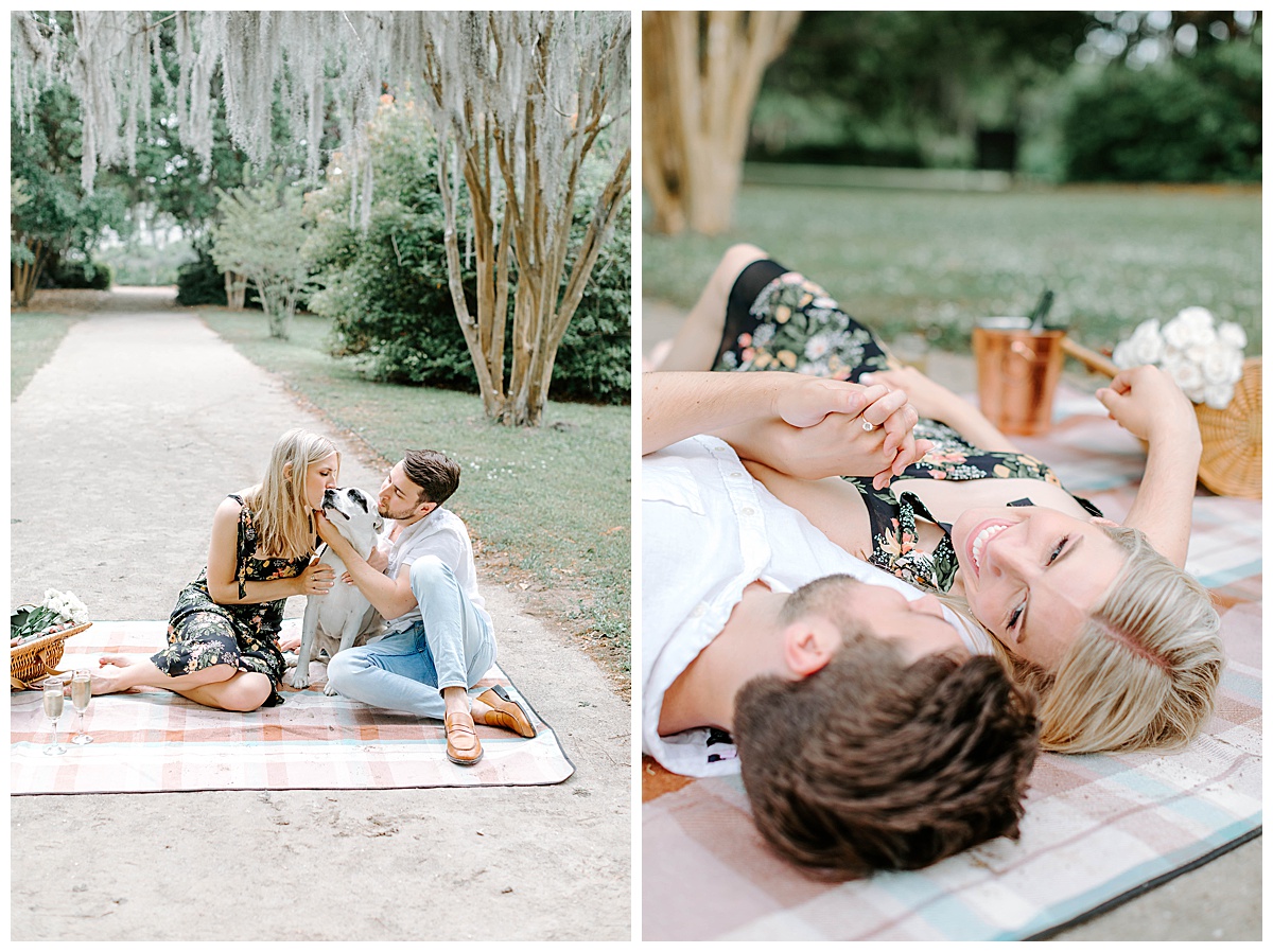 couple sitting on path under spanish moss and laying on picnic blanket holding hands